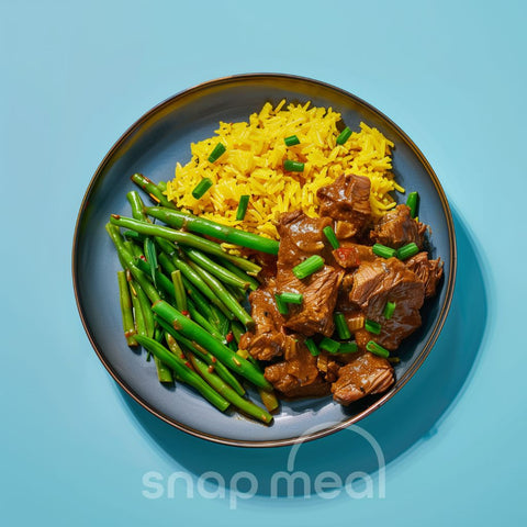 Daging rendang with yellow rice and sajoer beans